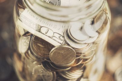 jar with coins and bills